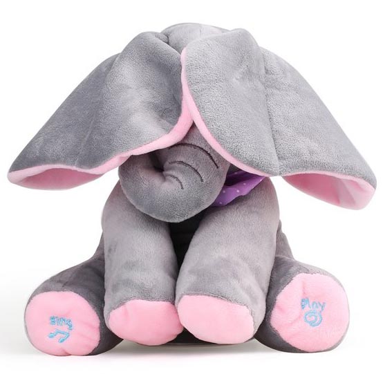 Plišani slon koji peva i pomera uši. Slatki sivi slon sa ružičastim detaljima peva dečiju pesmicu, uši mu se pomeraju u ritmu muzike