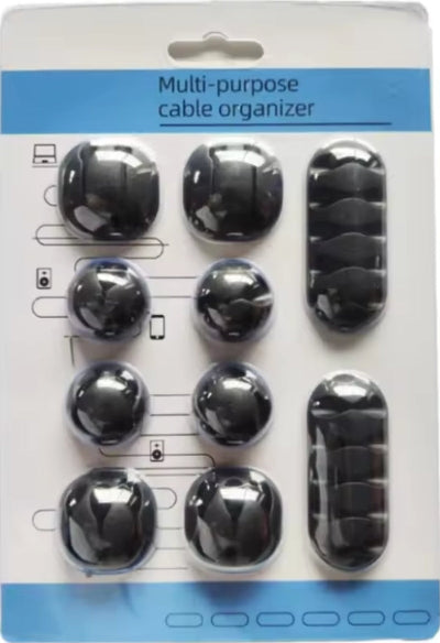 Pakovanje crnih multi-purpose organizatora za kablove. Idealno za uredjenje kablova na stolu, racunar, punjace.