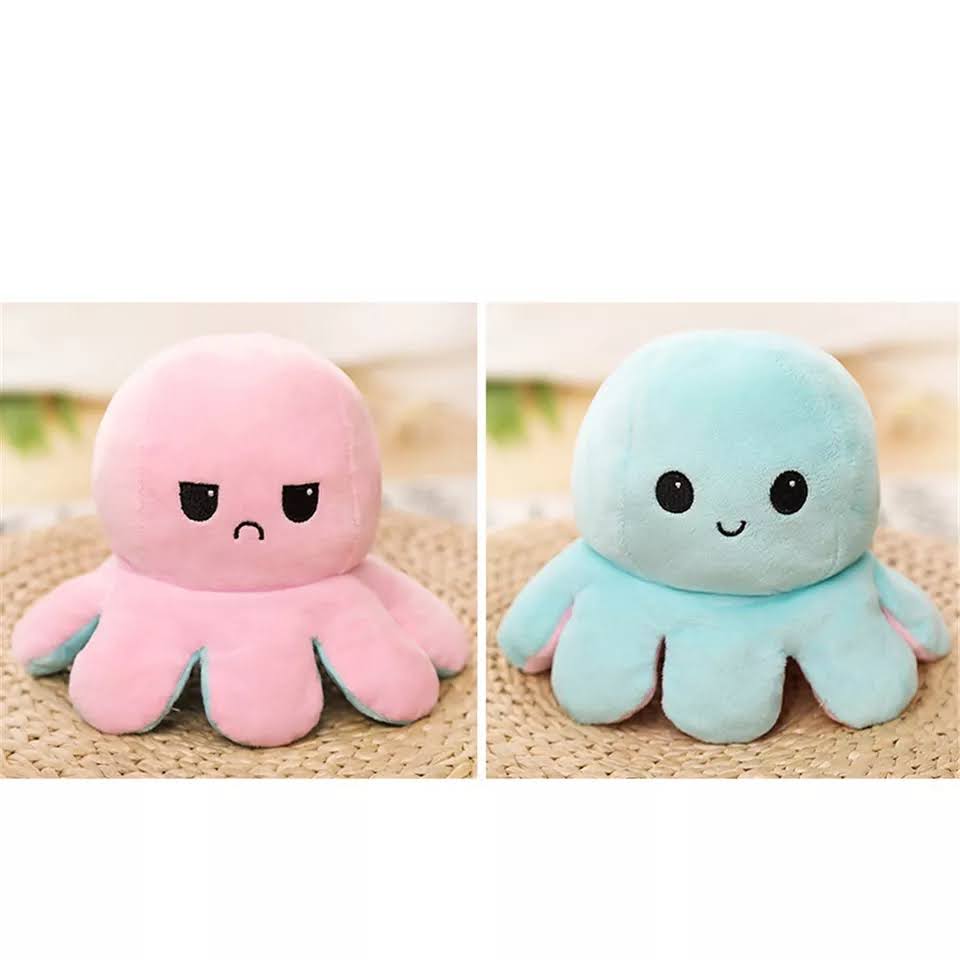 Plisana hobotnica pink i tirkizna igracka za izrazavanje raspolozenja reverzibilna