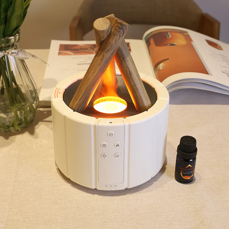 beli aroma difuzer sa efektom plamena na stolu