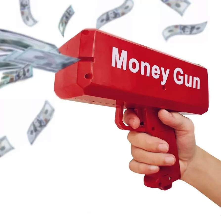 Crveni pistolj za izbacivanje novca u ruci