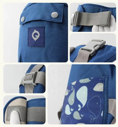 Detalji kopci i traka na plavoj ergonomskoj nosiljci za bebe
