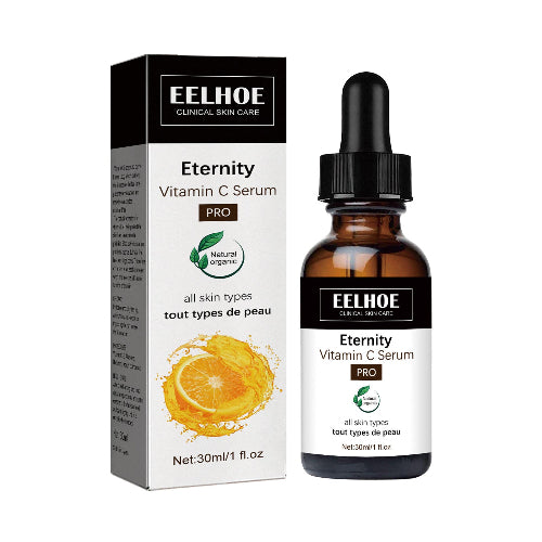 Prikaz pakovanja i bočice Eelhoe Eternity Vitamin C Seruma PRO. Kutija je crne i bele boje sa slikom narandže i natpisima "EELHOE CLINICAL SKIN CARE", "Eternity Vitamin C Serum PRO", "Natural Organic", "all skin types tout types de peau" i neto zapreminom "Net: 30ml/1 fl.oz". Bočica je braon staklena sa crnom pipetom i etiketom koja ponavlja iste natpise.