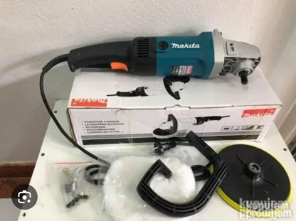 Električni polirač marke  od 1200W u plavo-crnoj boji, postavljen na originalnoj kutiji, sa pratećom opremom uključujući disk za poliranje, dodatnu ručku i druge delove.