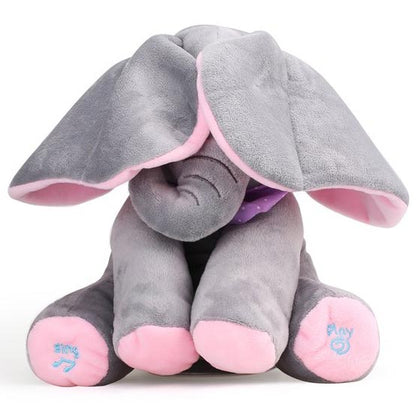 Plišani slon koji peva i pomera uši. Slatki sivi slon sa ružičastim detaljima peva dečiju pesmicu, uši mu se pomeraju u ritmu muzike