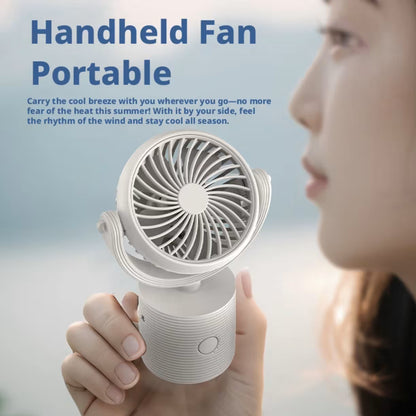 Profilni prikaz devojke koja drzi i koristi mali beli rucni ventilator za osvezenje na otvorenom prostoru