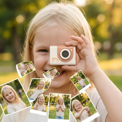 Malo dete koristi mini deciju kameru za portret fotografije