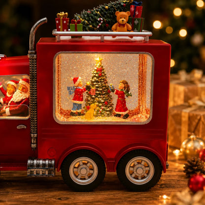 Zadnji deo novogodisnjeg kamiona sa osvetljenom jelkom i decom
