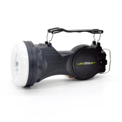 Prenosiva LED kamperska lampa polozena sa ruckom za nosenje