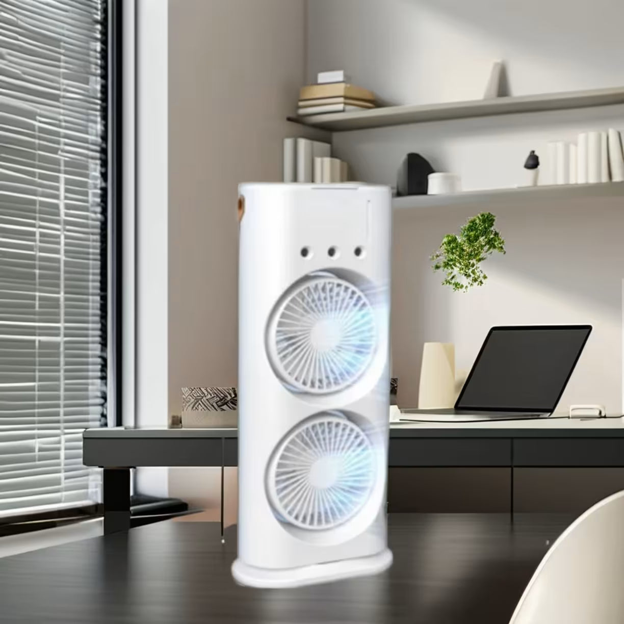 Beli uredjaj sa duplim ventilatorom koji radi na radnom stolu u kancelariji pored laptopa