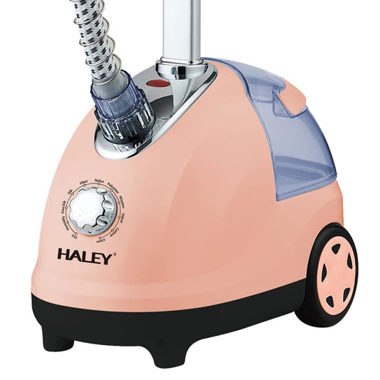 Profesionalna vertikalna pegla na paru roze boje sa velikim rezervoarom za vodu i tockicima za lako pomeranje