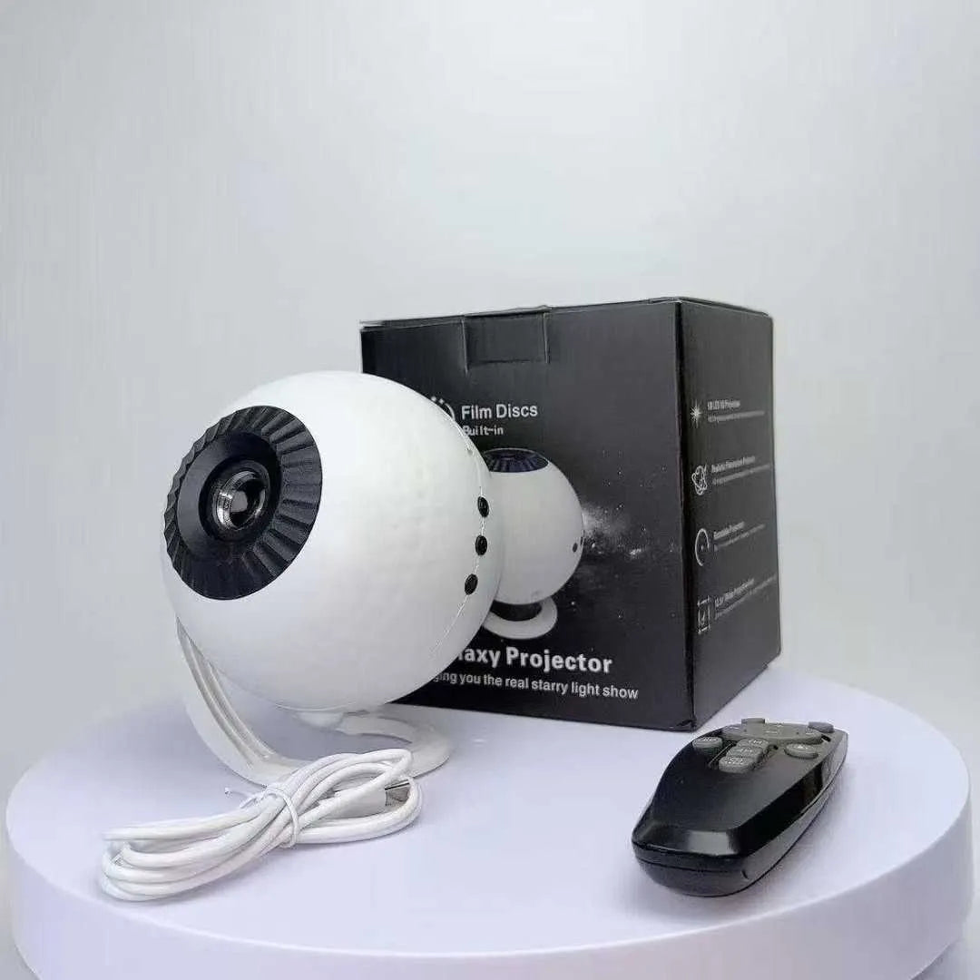 projektor svemira sa daljinskim upravljacem i projekcionim diskovima

