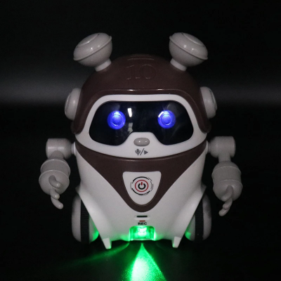 Robot igracka za decu sa svetlecem ocima i prednjim svetlom za nocnu igru. Pomaze u razvoju i zabavi malisana. Odlican interaktivni poklon.