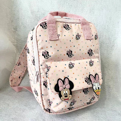 Mali dečiji ruksak za nošenje na ledjima. Ranac svetlo roze boje za izlete skolu i setnje.