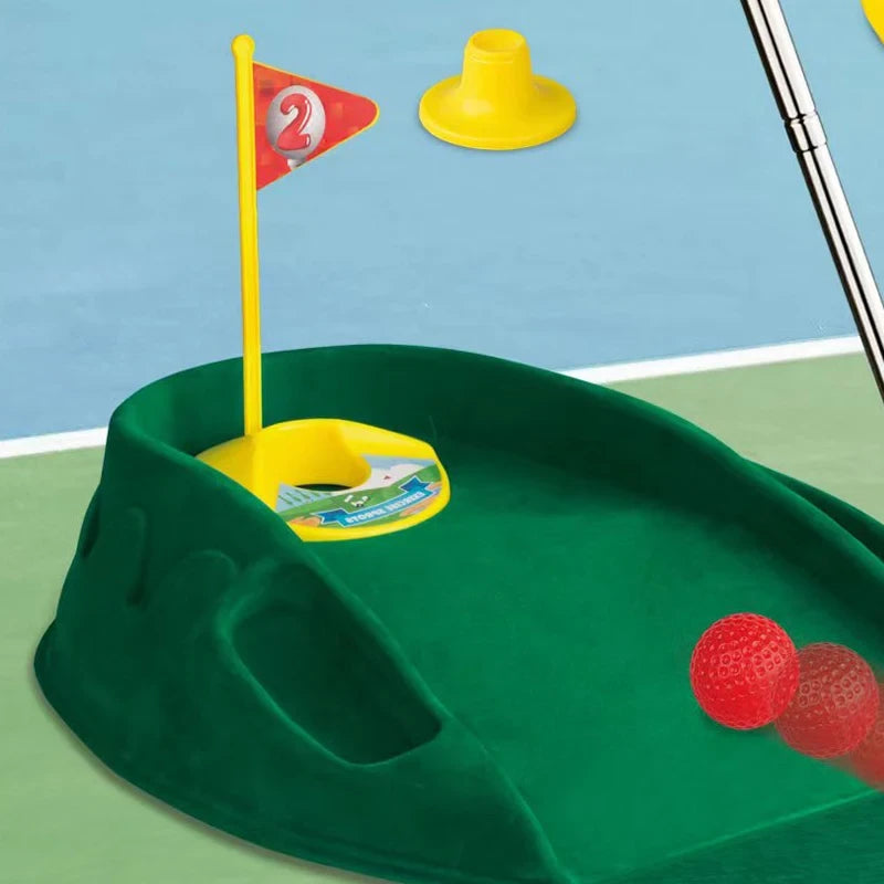 Rupa sa zastavicom i crvenim lopticama iz decijeg seta za golf