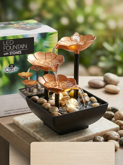 Sobna dekorativna fontana sa LED svetlom i kamenjem ispred kutije