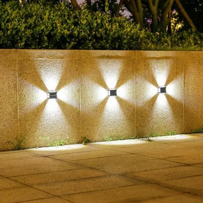 Solarne zidne lampe osvetljavaju dvorisni zid i stazu u cetiri smera