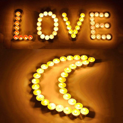 Svecice u obliku reci ljubav i srca romanticne svecice za dan zaljubljenih dekorativne svecice ambijent svecana rasveta.