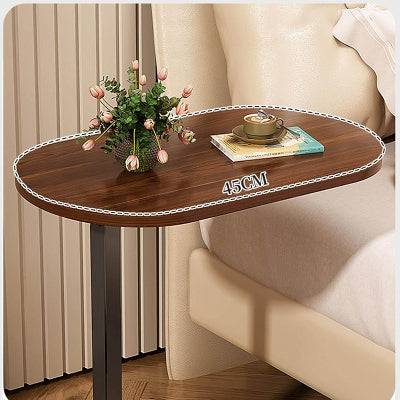 Funkcionalan tamni C oblik sto sa casopisom i casom. Idealan za rad ili opustanje iz udobnosti garniture.