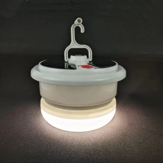 Sklopiva solarna LED lampa sa toplim belim svetlom i integrisanom kukom za kačenje
